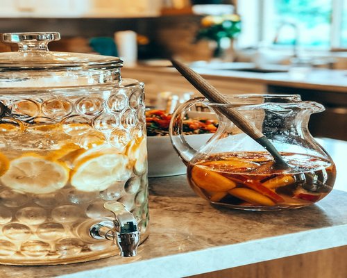 A pitcher of fresh fruit water and a homemade meal