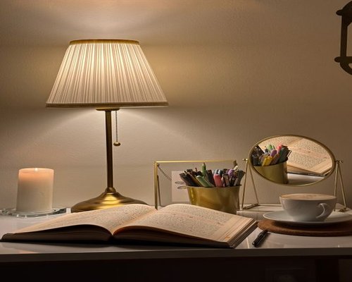 Cozy evening reading setup with a warm desk lamp